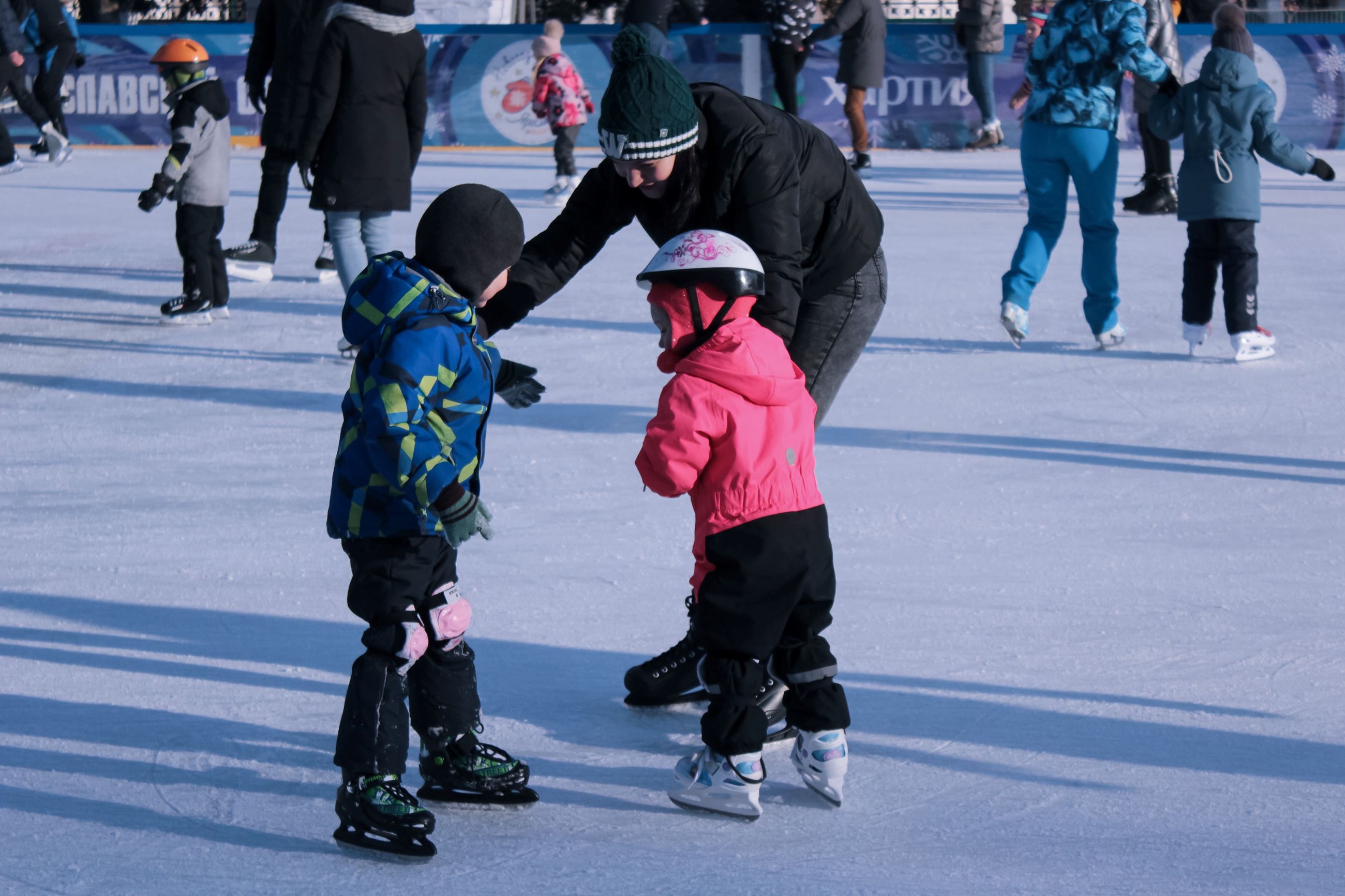 Father and Two Kids Ice Staking